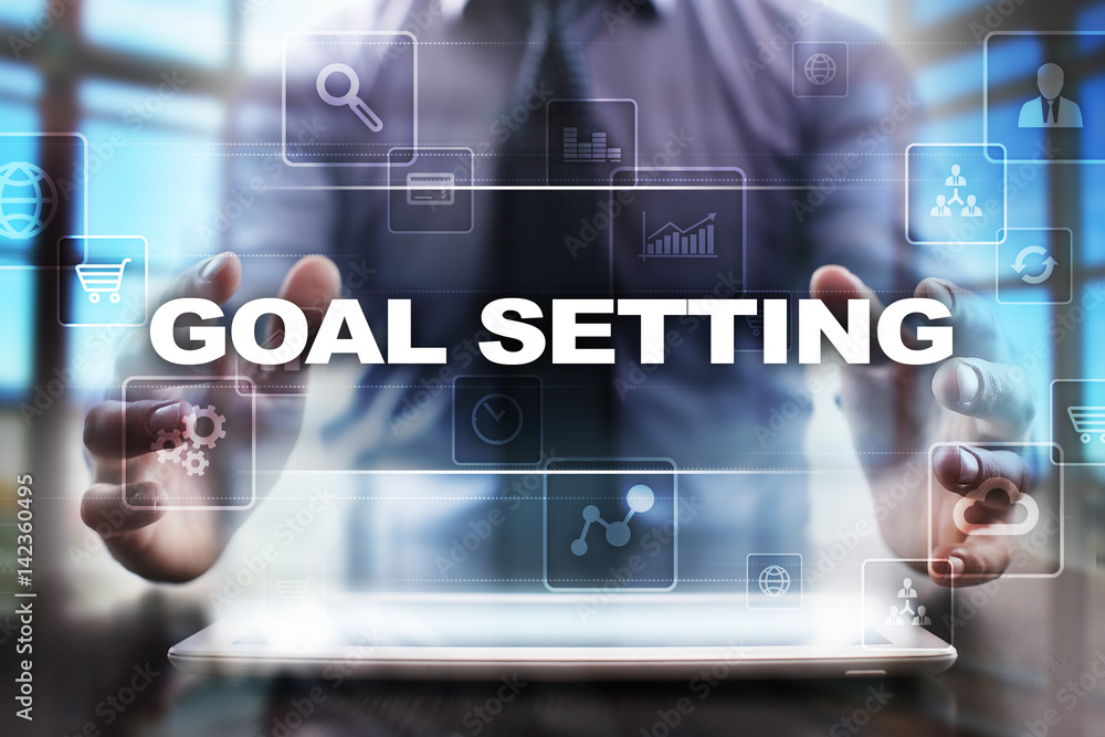 Businessman using tablet pc and selecting goal setting. Businessman using tablet pc and selecting goal setting.