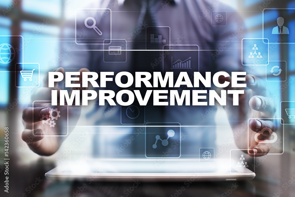 Businessman using tablet pc and selecting performance improvement. Businessman using tablet pc and selecting performance improvement.
