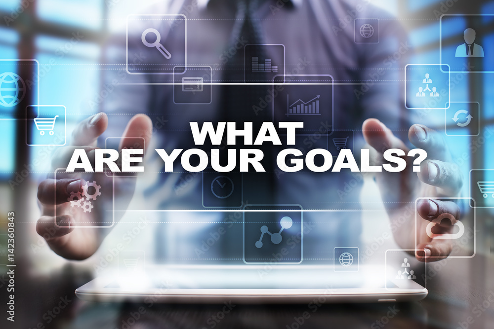 Businessman using tablet pc and selecting what are your goals. Businessman using tablet pc and selecting what are your goals.