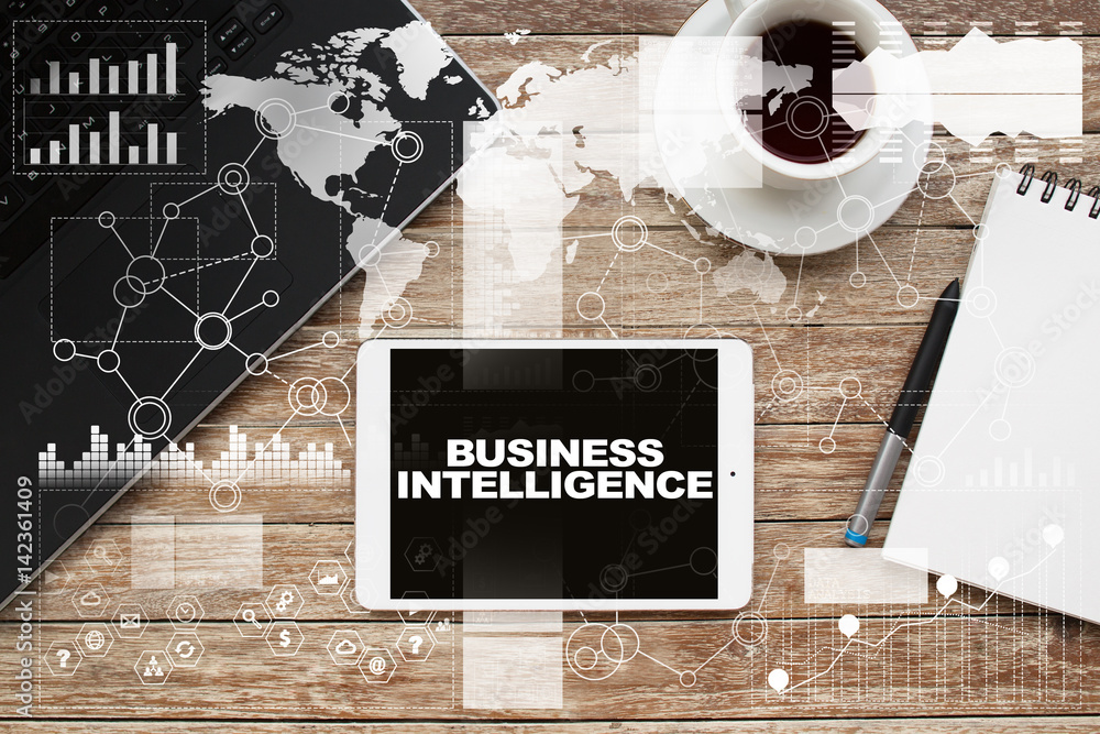 Tablet on desktop with business intelligence text. Tablet on desktop with business intelligence text.