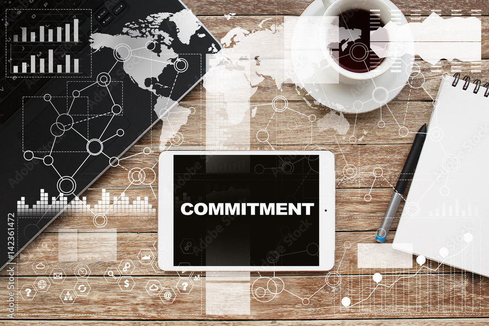 Tablet on desktop with commitment text. Tablet on desktop with commitment text.