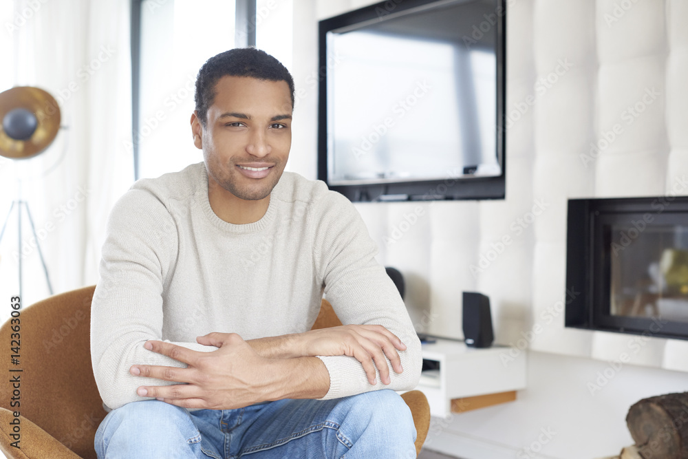 Weekend at home. Shot of an African American young man relaxing on the sofa. Weekend at home. Shot of an African American young man relaxing on the sofa.
