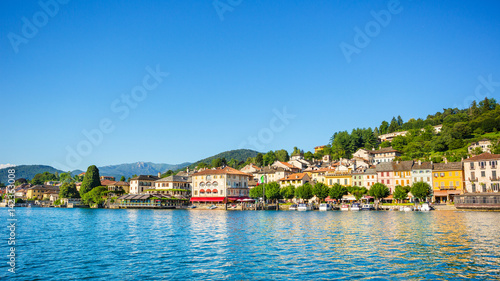 View of Motta square on Orta San Giulio from a touristic boat, Lake Orta, Piedmont, Italy