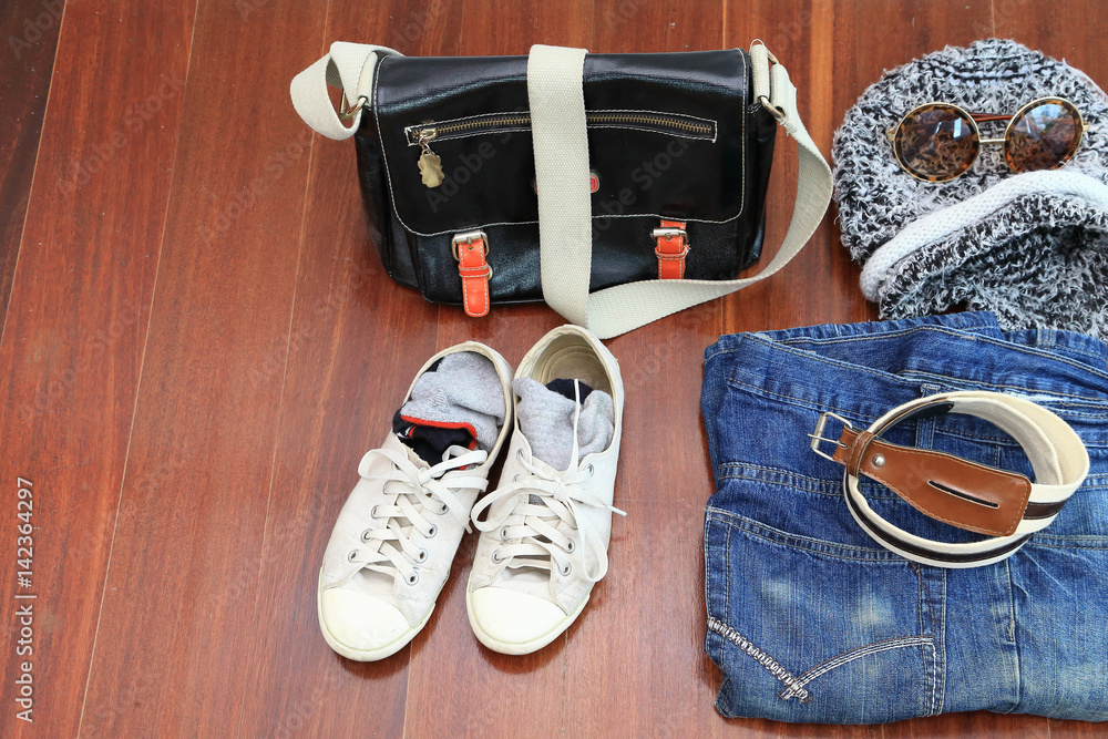 Women's sneakers, sunglasses, jeans, Ladies travel concept, as background or print card. Women's sneakers, sunglasses, jeans, Ladies travel concept, as background or print card.