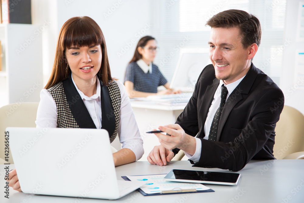 Young businesspeople working with laptop Young businesspeople working with laptop