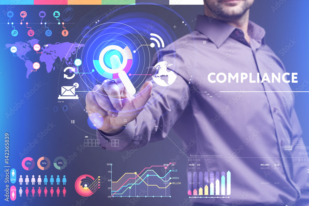 Business, Technology, Internet and network concept. Young businessman working on a virtual screen of the future and sees the inscription: Compliance Business, Technology, Internet and network concept. Young businessman working on a virtual screen of the future and sees the inscription: Compliance