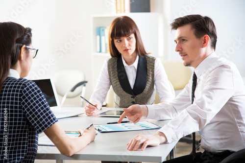 Wallpaper Mural Young businesspeople working with laptop Torontodigital.ca
