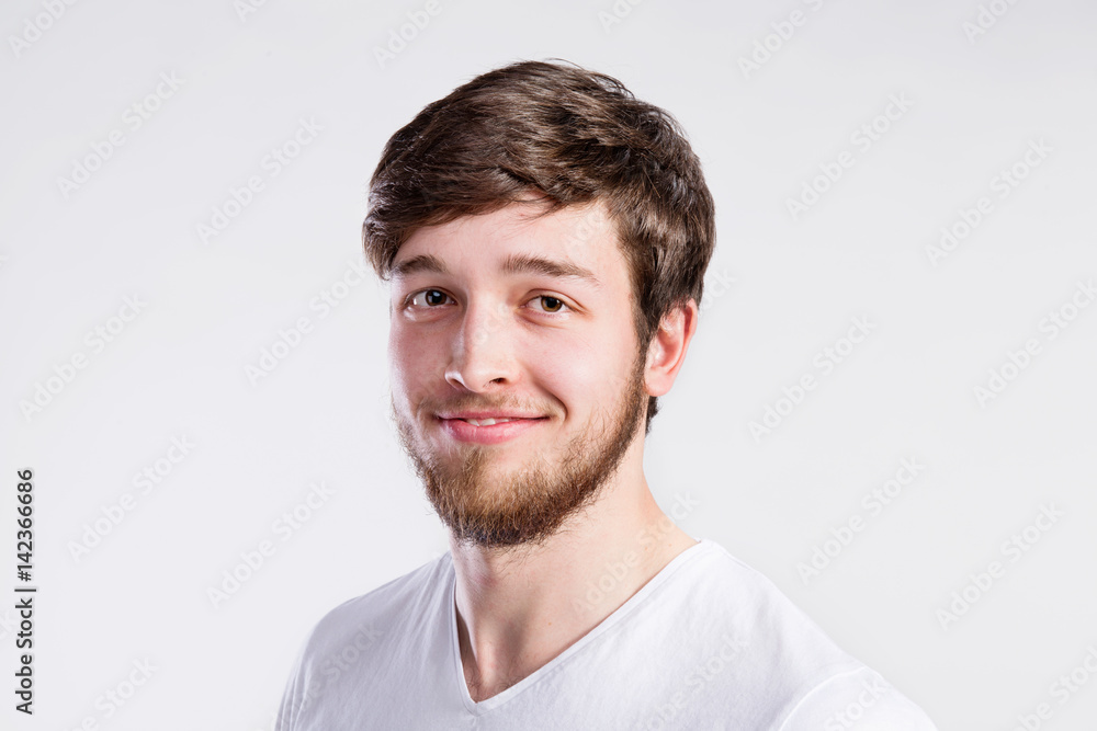 Fototapeta premium Handsome hipster fitness man in white t-shirt, studio shot.