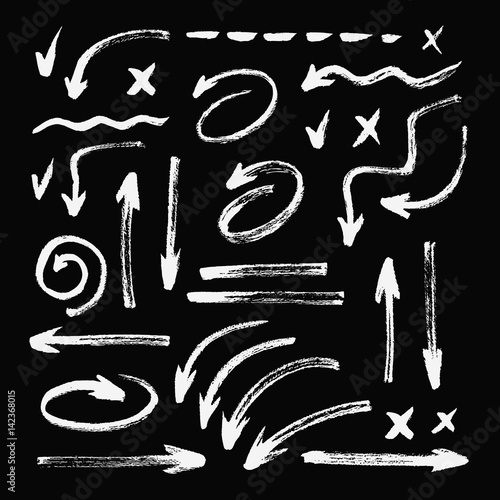 Set of different hand drawn grunge brush strokes, arrows. Isolated on black background