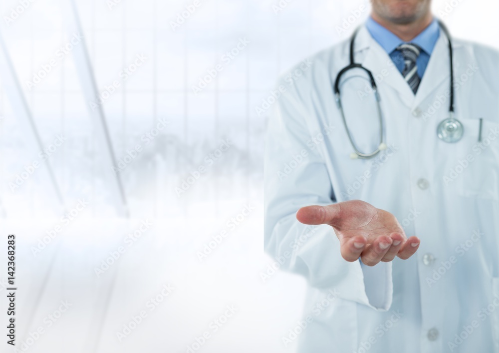 Doctor mid section with hand out against blurry window Doctor mid section with hand out against blurry window