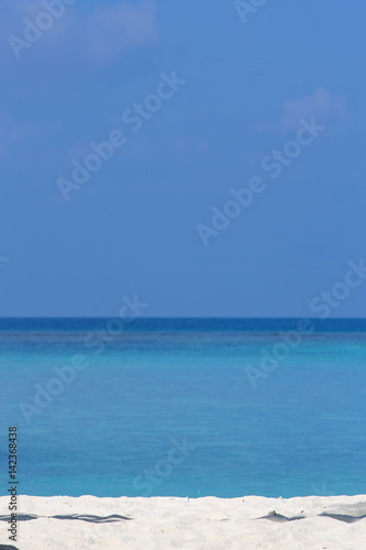 Tropical white sandy beach on the ocean coast. Maldives © alexmalder