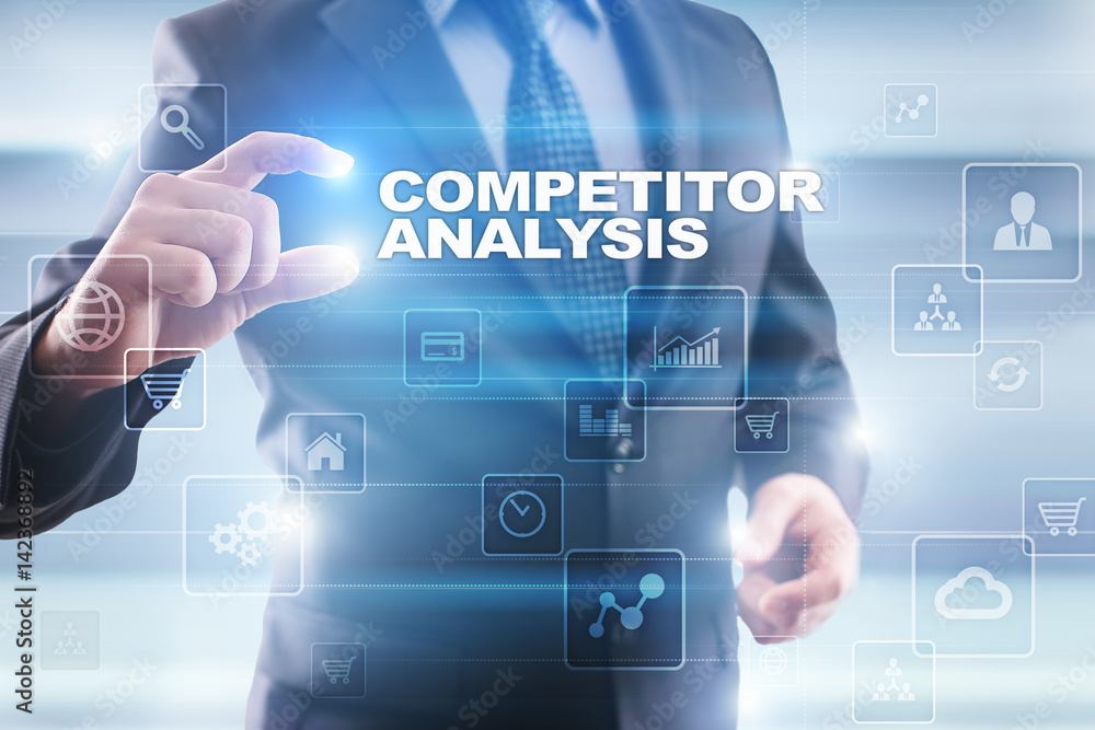 Businessman selecting competitor analysis on virtual screen. Businessman selecting competitor analysis on virtual screen.