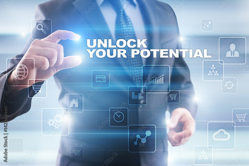 Businessman selecting unlock your potential on virtual screen. Businessman selecting unlock your potential on virtual screen.