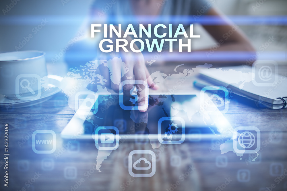 Fototapeta premium Woman using tablet pc, pressing on virtual screen and selecting financial growth.