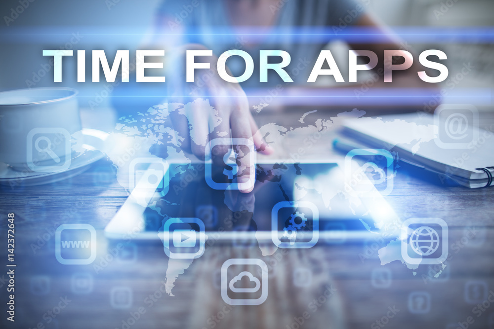 Fototapeta premium Woman using tablet pc, pressing on virtual screen and selecting time for apps.