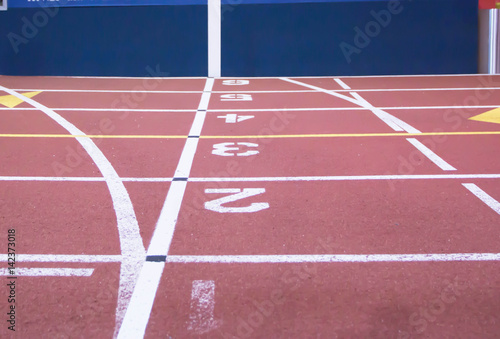 The start and finish line at an indoor track