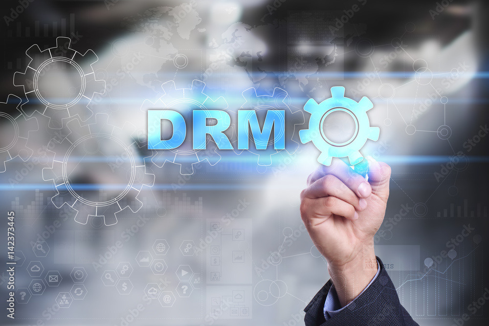 Businessman is drawing on virtual screen. drm concept. Businessman is drawing on virtual screen. drm concept.