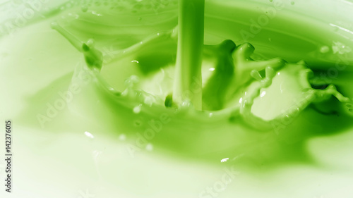 Photo of liquid about the consistency of the milk in colour green