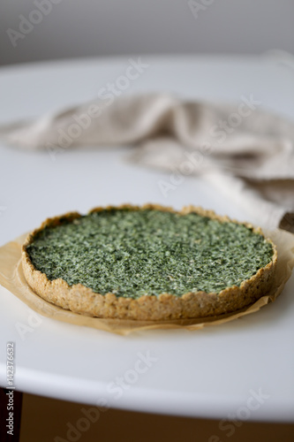 Round pie with spinach and Ricotta cheese. Food background