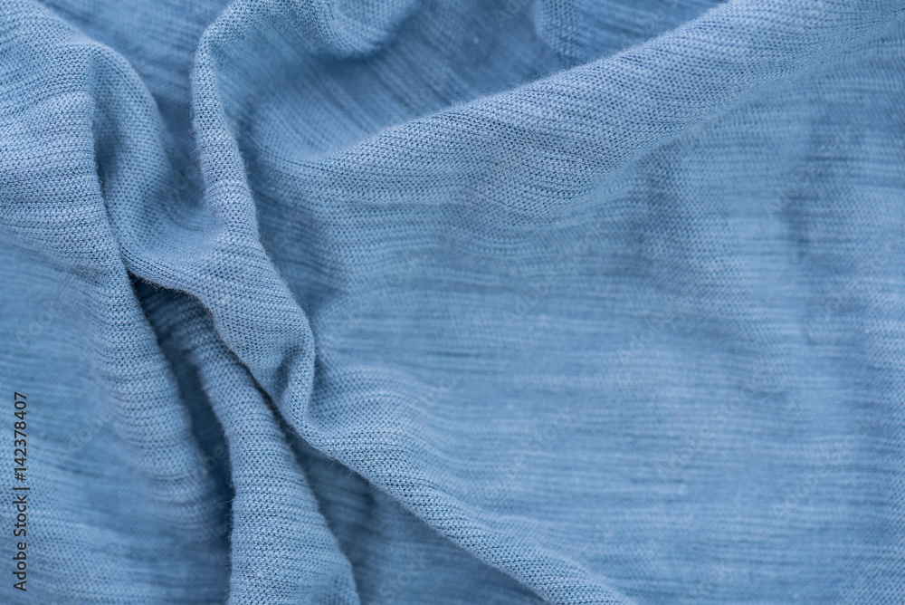 Light blue wrinkled fabric. Light blue wrinkled fabric.
