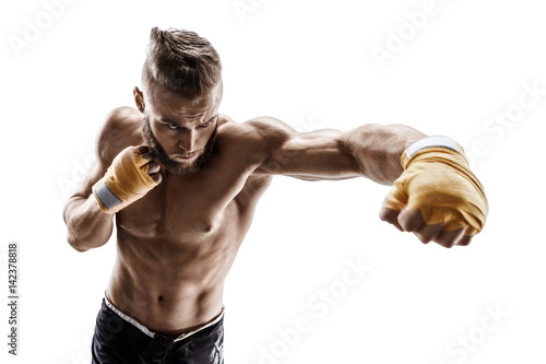 Muscular man throwing a fierce and powerful punch. Photo of sporty man isolated on white background. Strength and motivation