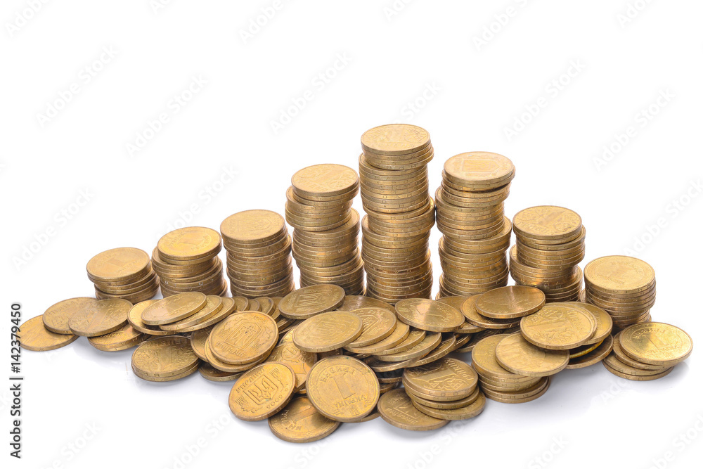 Coin stacks on a white background. Ukrainian hryvnia. Coin stacks on a white background. Ukrainian hryvnia.