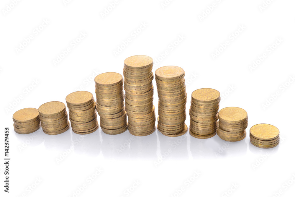 Coin stacks on a white background. Ukrainian hryvnia. Coin stacks on a white background. Ukrainian hryvnia.