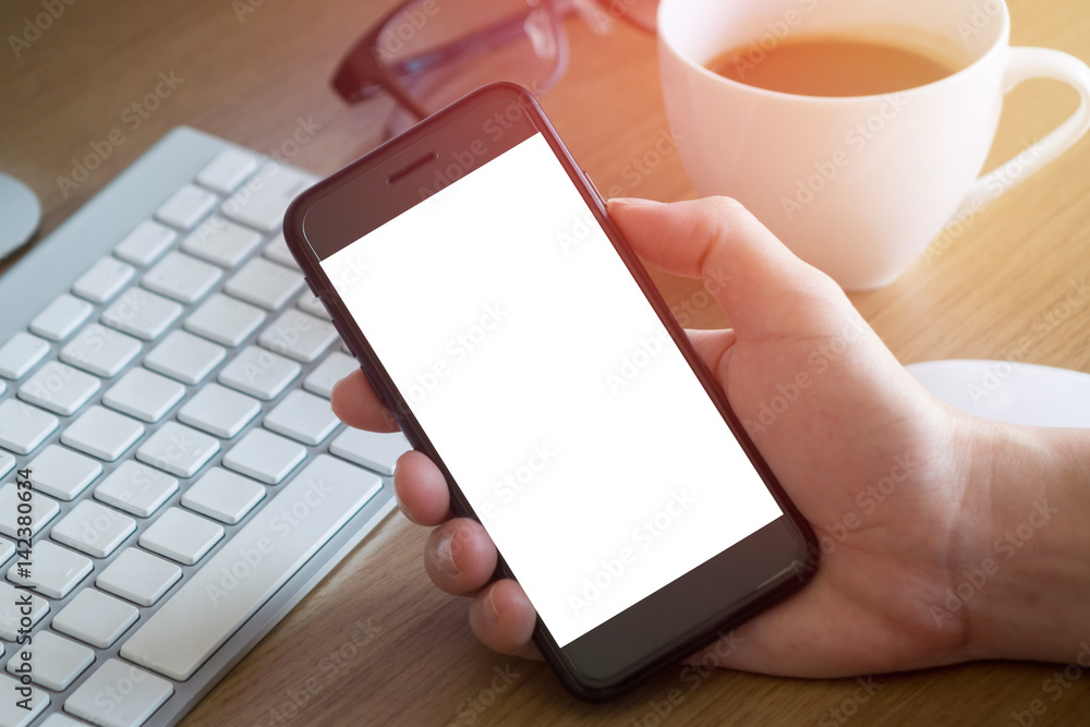 woman hands holding empty screen of smartphone on wood desk work woman hands holding empty screen of smartphone on wood desk work