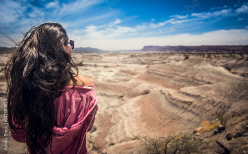 Girl watching desert, Ischigualasto, Argentina