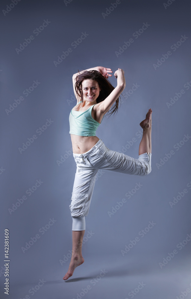 beauty girl dance on grey background