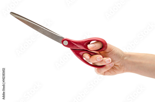 female hand holding scissors.