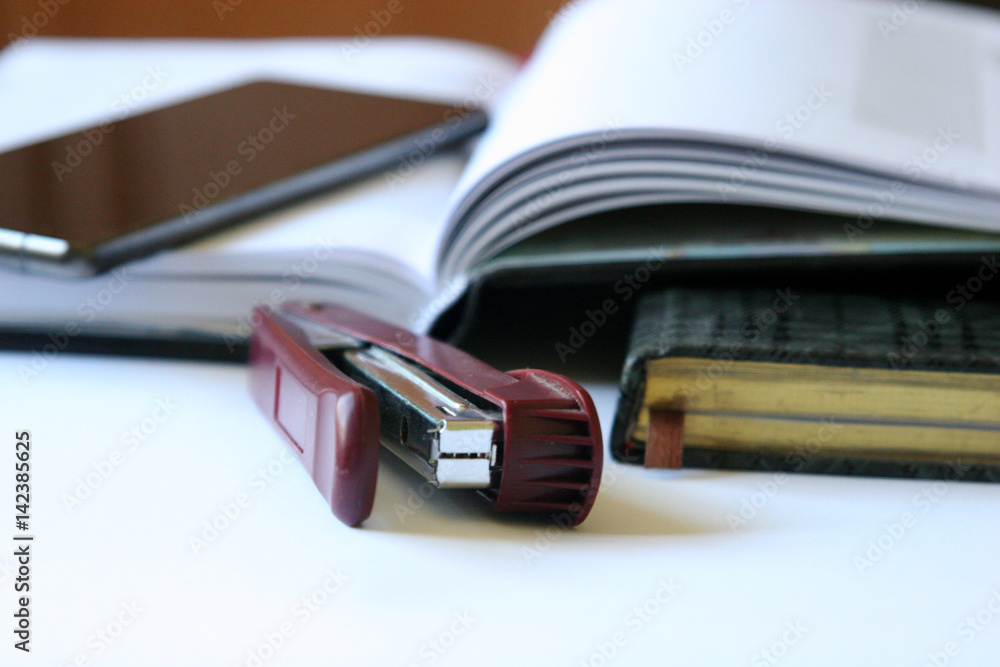 Open book with a exercise books on the table Open book with a exercise books on the table