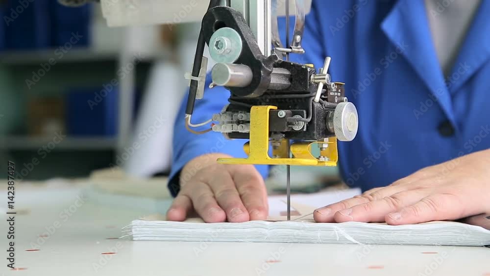Female worker cutting templates Female worker cutting templates