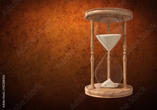 Egg Timer with sand against brown background