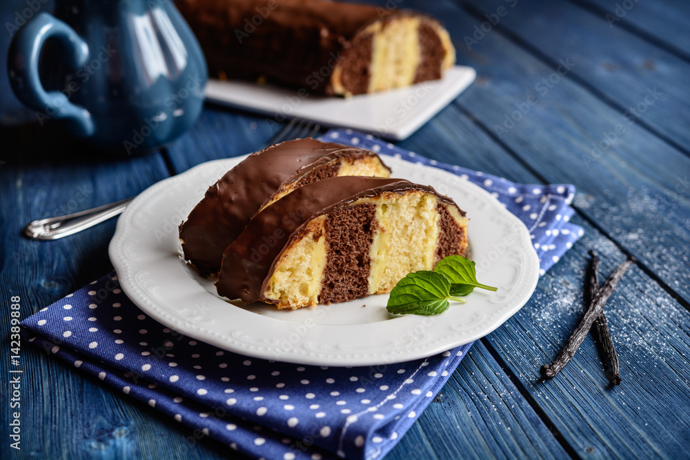 Traditional Meter Cake stuffed with vanilla cream and chocolate topping Traditional Meter Cake stuffed with vanilla cream and chocolate topping