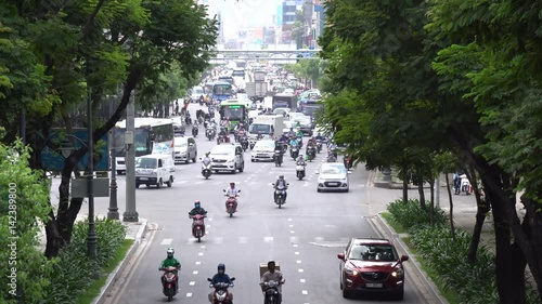 Ho Chi Minh city, Viet Nam - 22 Ferb, 2017: Traffic light in Vietnam - Street by moto bike is an essential part of life in Ho Chi Minh city, Vietnam. photo