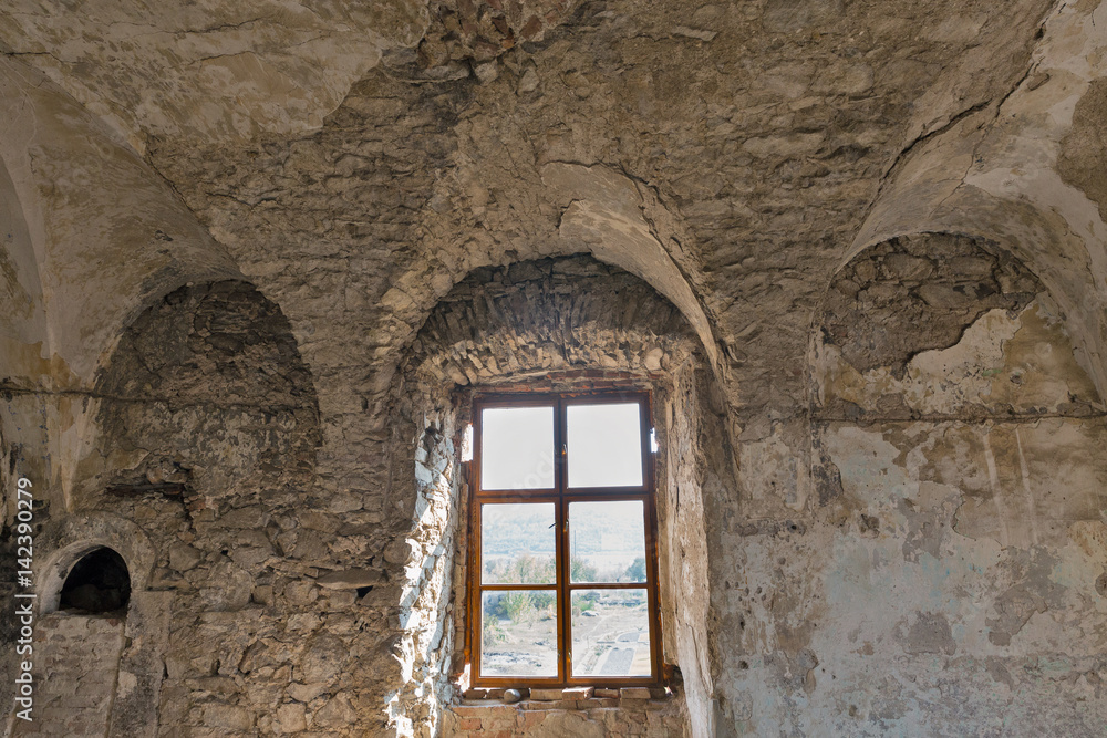 Abandoned medieval castle Saint Miklosh interior, Chinadievo, Western Ukraine.