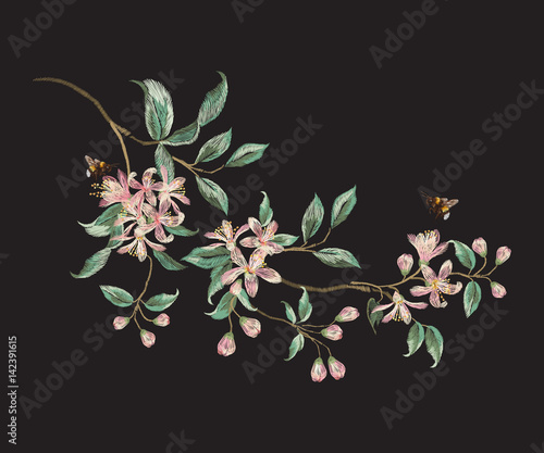 Embroidery trend floral pattern with branch of tropical japanese flowers. Vector traditional folk sakura and bees on black background for design.