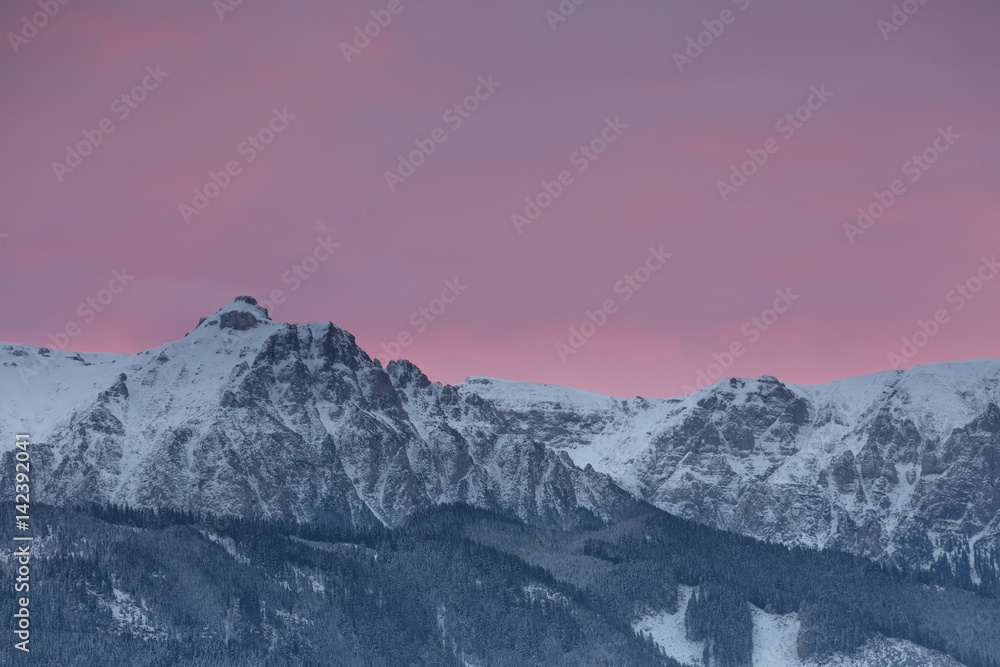 Majestic sunset in the winter mountains landscape.
