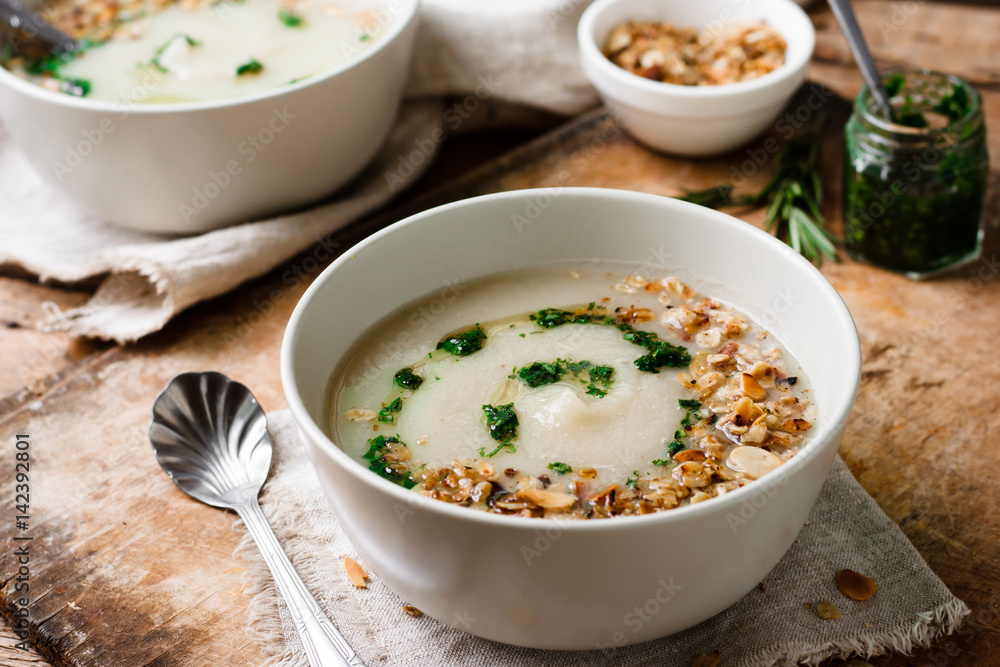 Celery cream soup with green oil and granola Celery cream soup with green oil and granola