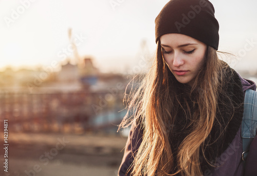 Portrait of a sad girl at sunset