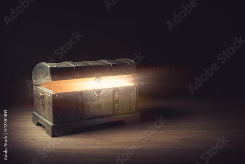 open pandora's box with smoke on a wooden background