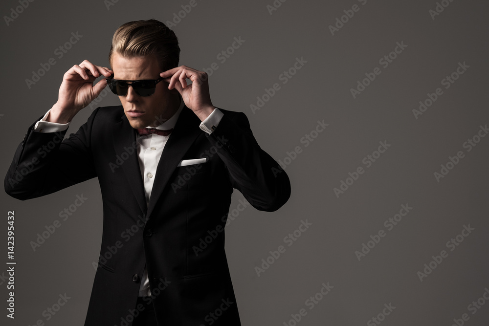 Confident sharp dressed man in black suit Confident sharp dressed man in black suit