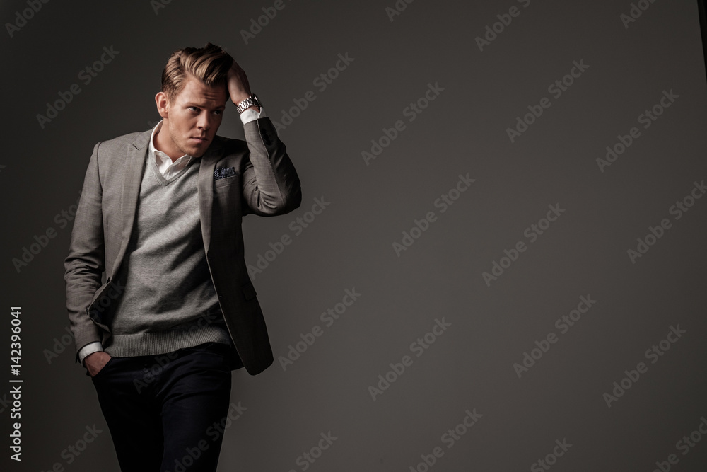 Confident sharp dressed man in grey jacket Confident sharp dressed man in grey jacket