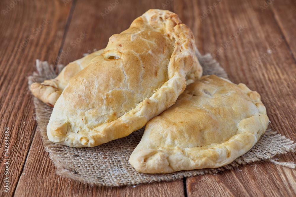 Delicious homemade Cornish pasties with beef, onions and potato. Delicious homemade Cornish pasties with beef, onions and potato.