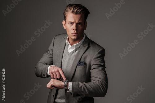 Confident sharp dressed man in grey jacket © Nejron Photo
