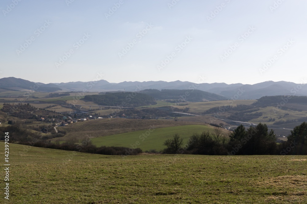 Fototapeta premium Meadow with trees and views to mountains. Slovakia