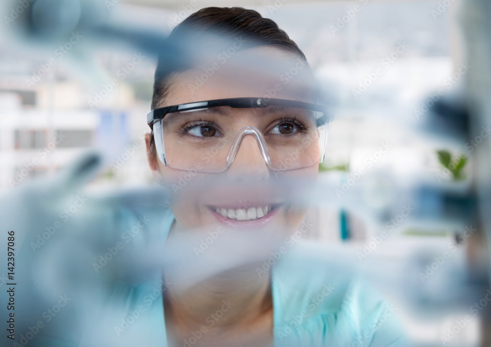 Close up of woman through electronics in office