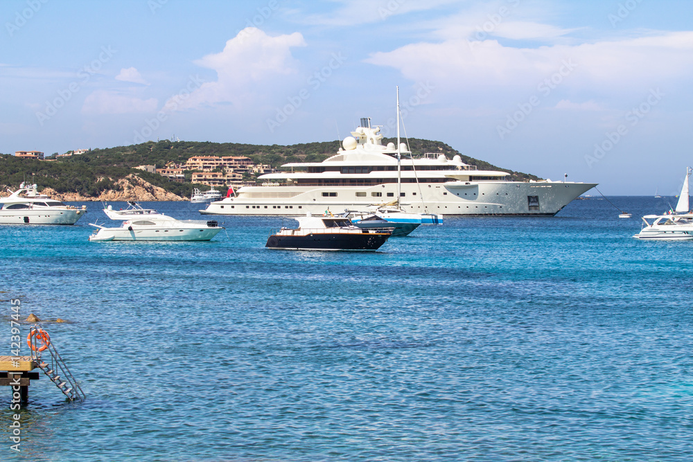 Luxury yachts at Porto Massimo bay at Sardinia Island, Italy