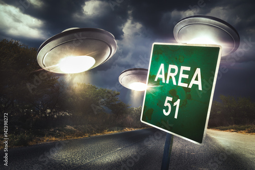 Area 51 sign on a road with dramatic lighting